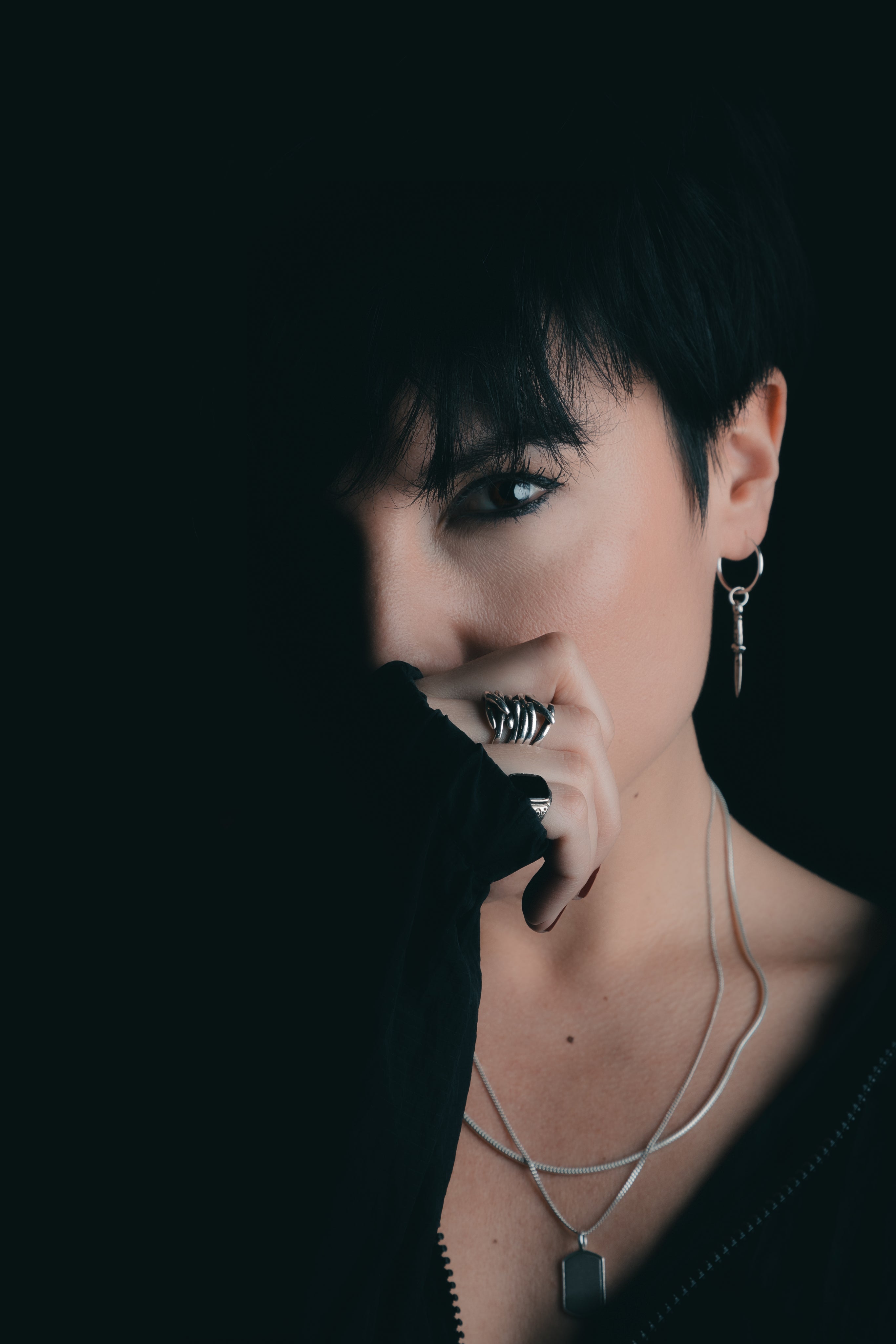files/woman-holds-hand-over-bottom-half-of-her-face.jpg